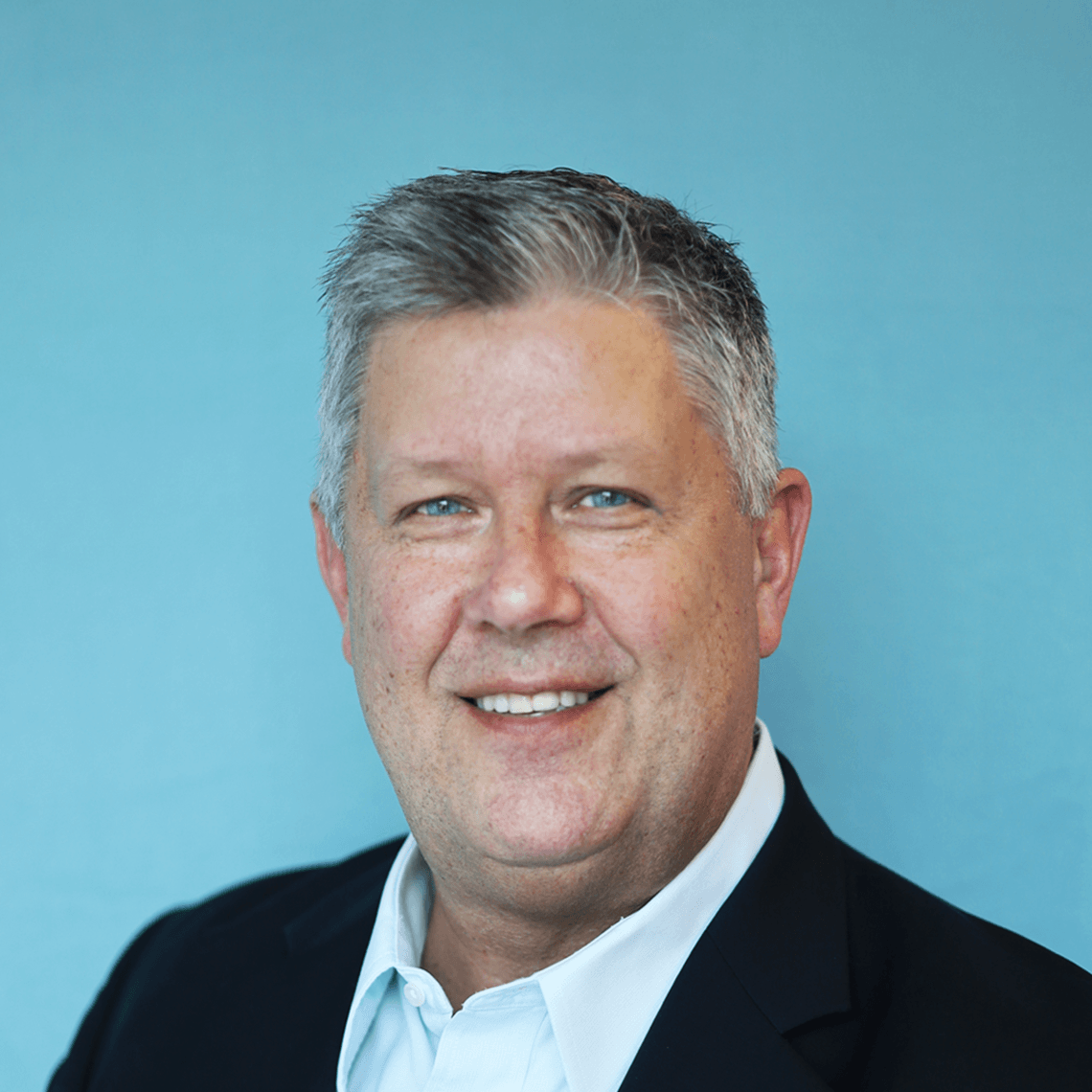 Mike P's headshot against a blue background