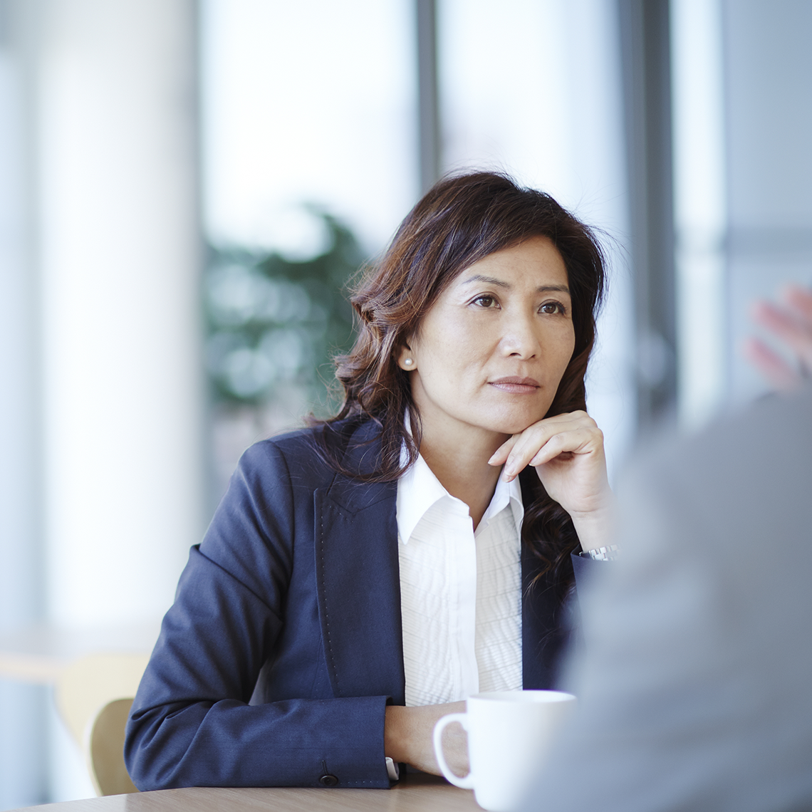 woman involved in a serious conversation with an unseen person
