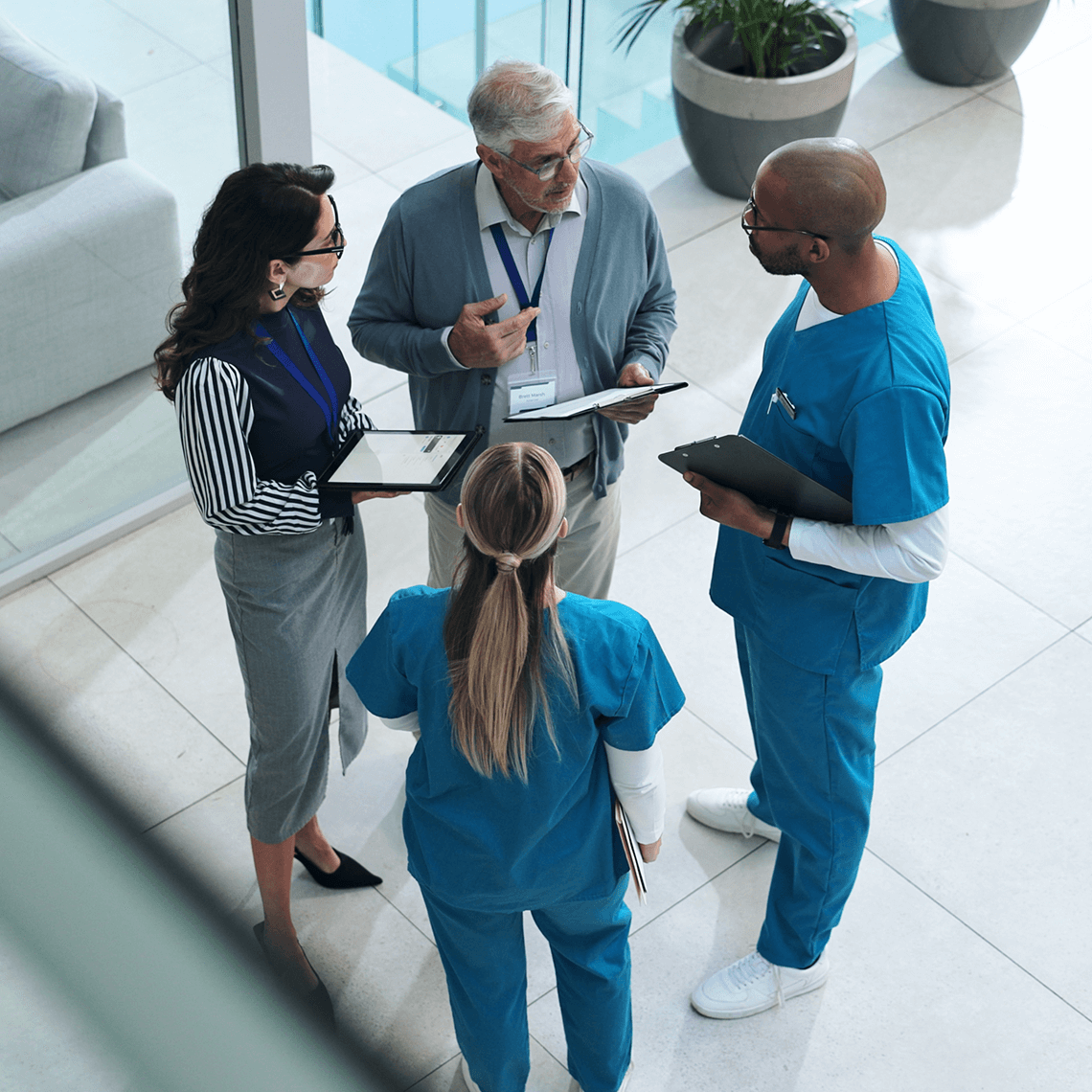 Clinical workers conversing in a hall