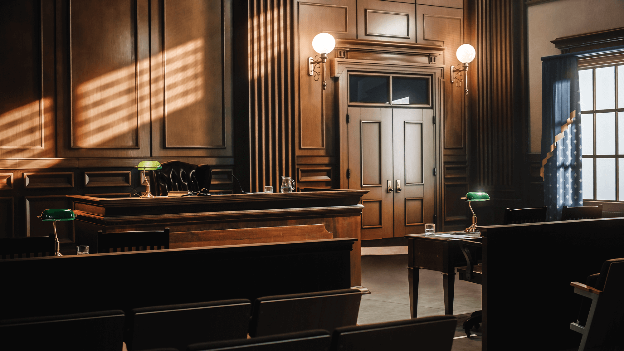 Interior of a courtroom with a judge presiding at the bench, showcasing a formal legal environment