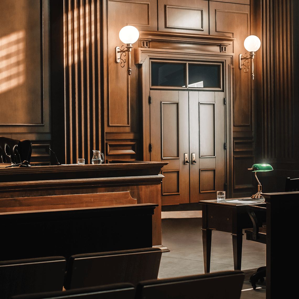 Interior of a courtroom with a judge presiding at the bench, showcasing a formal legal environment