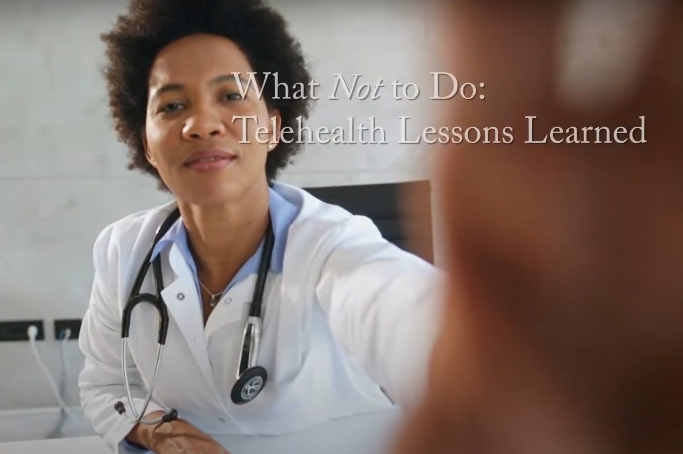 doctor adjusts camera during telehealth visit